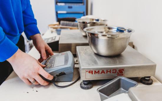 A civil engineering student conducting a soil testing lab